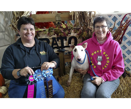 Chris Puhls with Cleo and a white bull terrier